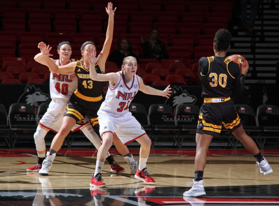 Senior guard Ally Lehman and redshirt sophomore forward Renee Sladek guard two Milwaukee Panthers during a home game on Nov. 16.