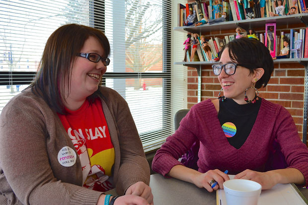 Students and alumni wear their "This is What a Feminist Looks Like" stickers to fight stereotypes tied to feminism Mar. 3, 2016. 