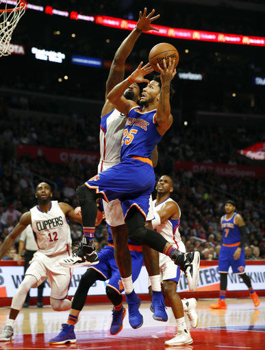 New York Knicks guard Derrick Rose goes to the basket against Los Angeles Clippers center DeAndre Jordan during the second half of an NBA game, March 20, in Los Angeles. The Clippers won 114-105. 