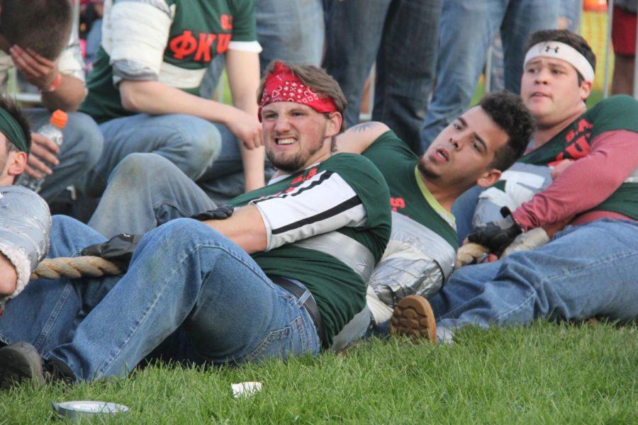 Members of Phi Kappa Psi tug together in a match.