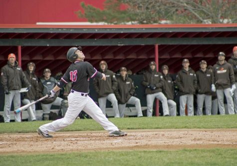 Junior infielder Brad Wood looks after hitting a pop-up that went foul. The Huskies lost two out of three games against University at Buffalo.