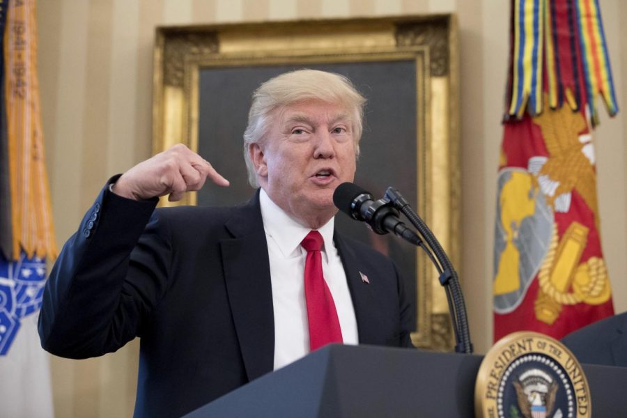 President Donald Trump speaks during a signing ceremony for executive orders regarding trade in the Oval Office at the White House March 31 in Washington.