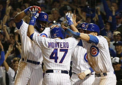 Chicago Cubs' Miguel Montero (47) celebrates a grand slam during the eighth inning of Game 1 of the National League baseball championship series against the Los Angeles Dodgers Saturday, Oct. 15, 2016, in Chicago. (AP Photo/Nam Y. Huh)