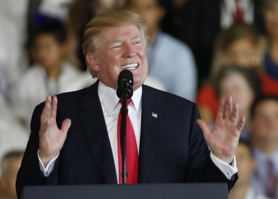 President Donald Trump gestures during a speech aboard the nuclear aircraft carrier USS Gerald R. Ford for it’s commissioning at Naval Station Norfolk in Norfolk, Va., Saturday.