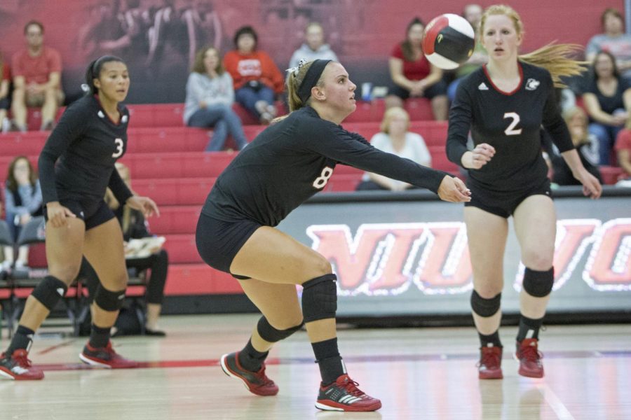 Senior outside hitter Taylor Krage hits the ball in their game against Iowa Friday. The Huskies went 0-3 in the tournament.