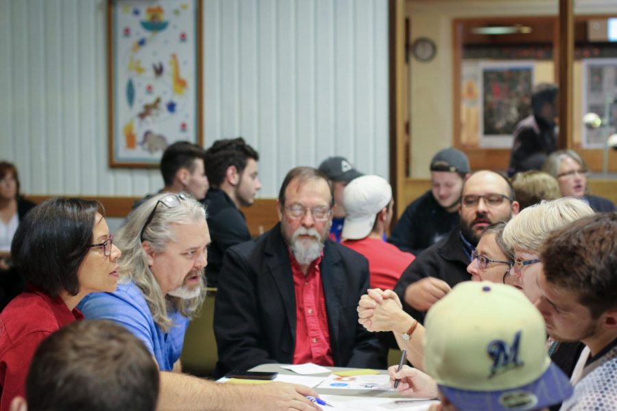 Members of the DeKalb and NIU community discuss concerns and needs of the community during a Wednesday community meeting for the Annie Glidden North Revitalization Plan. This meeting is part of phase one of the initiative. 