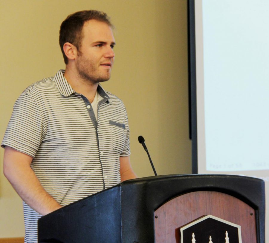 Jacon Michnick, DeKalb economic development planner, spoke about student involvement within living situations throughout town at the Student Association meeting Sunday.