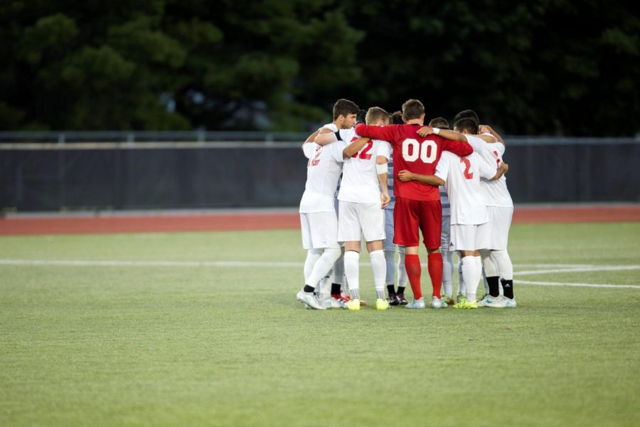 The+mens+soccer+team+comes+together+in+their+game+against+DePaul+Aug.+25.+The+Huskies+are+1-2-0+to+begin+the+season.