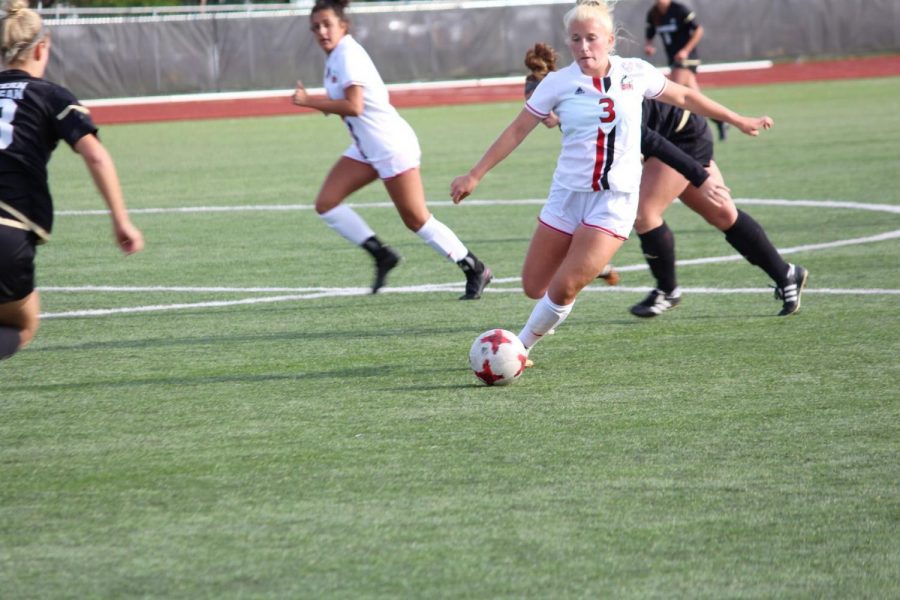 Sophomore forward Natalie Yass kicks the ball in the Huskies 1-0 loss Thursday to Western Michigan. NIU lost to Ball State Sunday 2-1 in the MAC Tournament Quarterfinals.