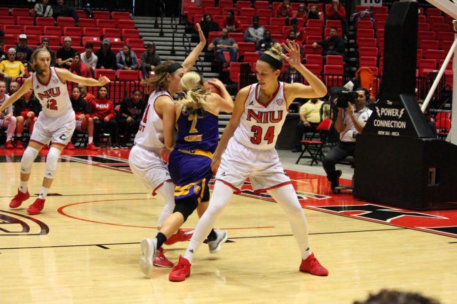 Redshirt sophomore forward Ally May and junior guard Mikayla Voigt play defense in the Huskies’ 96-94 home win Nov. 18 against Western Illinois. NIU is 4-2 on the season.
