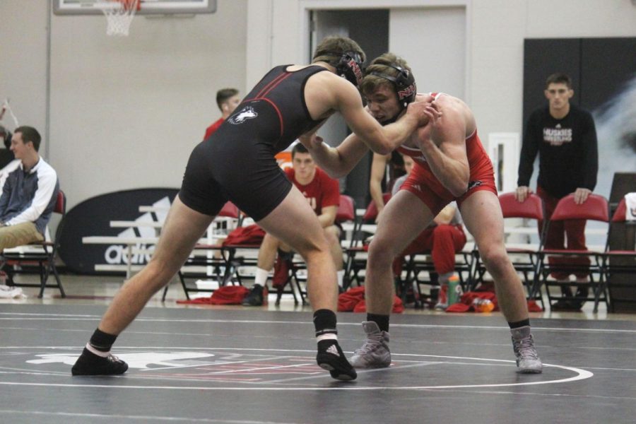 Sophomore Brock Hudkins faces his opponent in the Red/Black Dual Friday. The Huskies will begin the season 9 a.m. Saturday at the Iowa State Open.