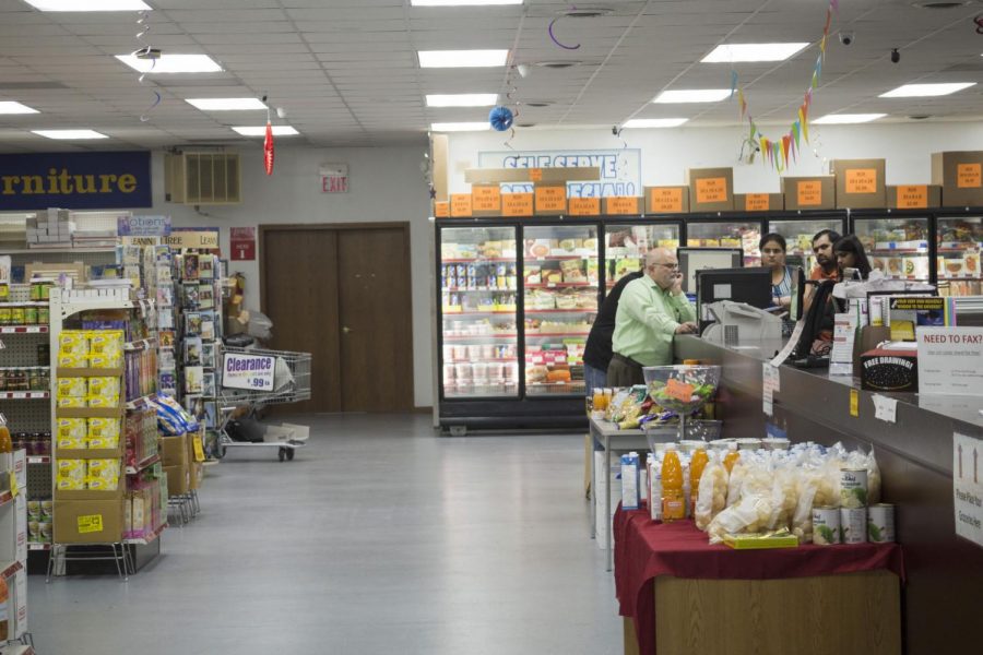 Employees at the Gurukrupa Indian Grocery & Copy Service, 1005 W. Lincoln Highway, engage with customers Wednesday. The grocer is one of multiple cultural food options in DeKalb that city officials say benefits the local economy and caters to the city’s diverse population.