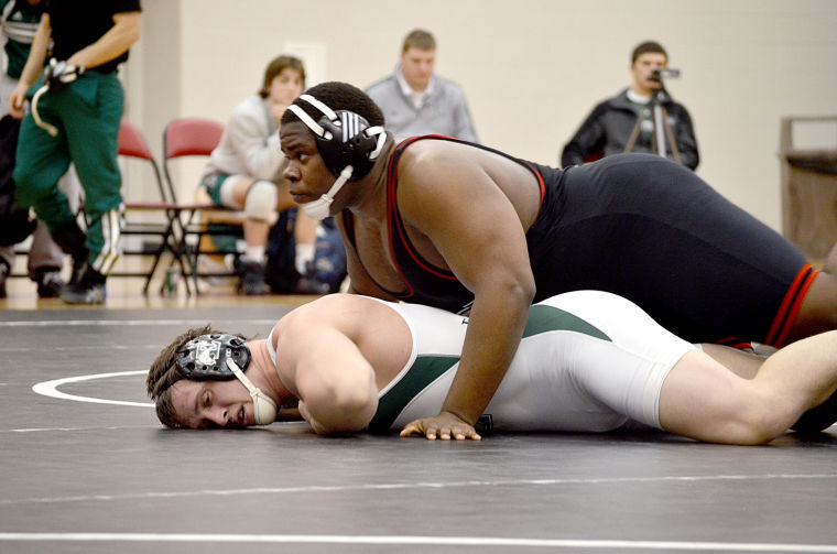 Junior+Jared+Torrence+looks+up+for+advice+from+the+coaching+staff+during+a+match+in+the+wrestling+meet+Saturday+versus+Eastern+Michigan%2C+he+went+on+to+win+his+match.%0A