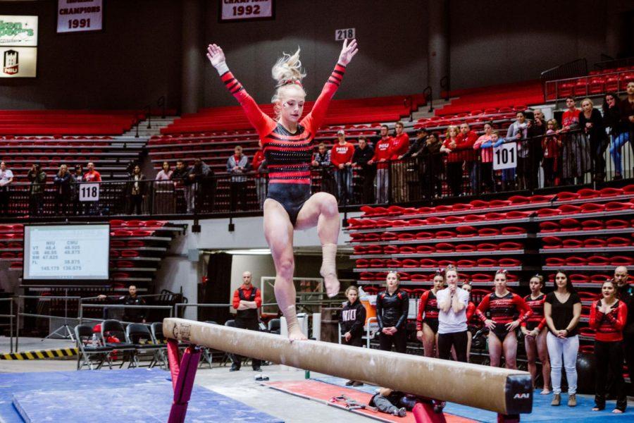 Senior Katherine Prentice balances on the beam in the Huskies’ home loss Sunday to Central Michigan. Prentice finished with a score of 9.675 on the balance beam. 