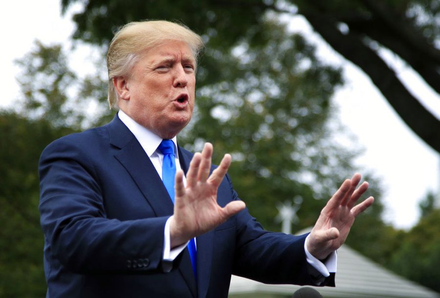 President Donald Trump speaks to reporters Oct. 13 on the South Lawn of the White House in Washington.