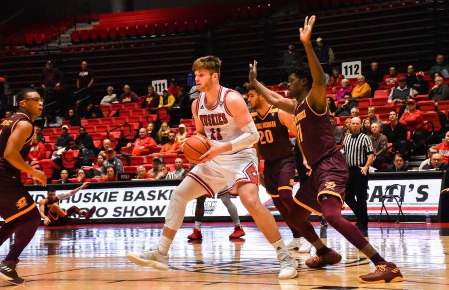 Sophomore Noah McCarty battles in the post in the Huskies’ 80-72 home loss Feb. 13 against Central Michigan. NIU fell to 5-10 in Mid-American Conference play Tuesday.