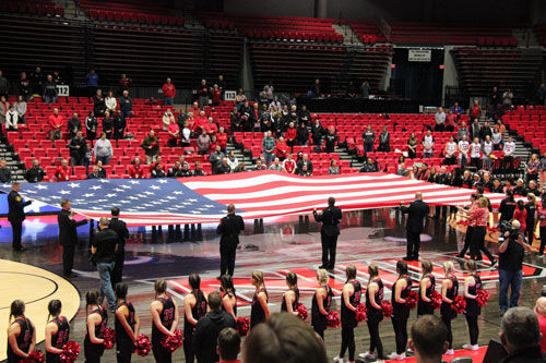 First responders to the Feb. 14, 2008 shooting hold the American flag at a recognition service during halftime of a men’s basketball game against Bowling Green Saturday.