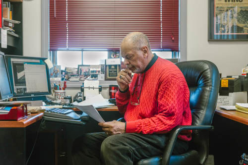 Don Bramlett, Center for Black Studies graduation specialist, works in his office March 22. Bramlett is set to retire from his position at NIU at the end of the spring semester after having held many positions across campus.