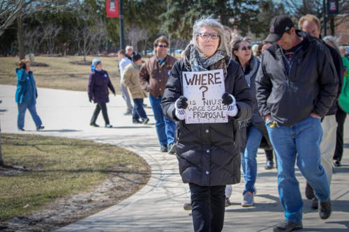 Barbara Andree, office manager and member of local 1890 marches at a labor union protest March 19 in the MLK commons. The union has been negotiating with the university for a bargaining agreement for over two years. 
