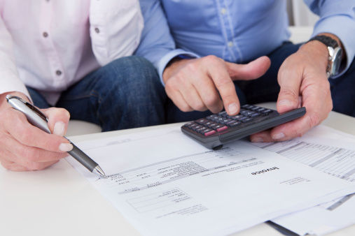 Close-up of couple doing finances at home