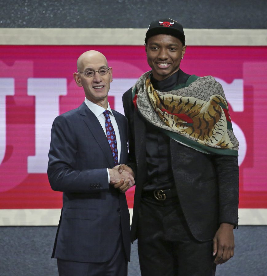 Dukes Wendell Carter Jr., right, poses with NBA Commissioner Adam Silver after he was picked seventh overall by the Chicago Bulls during NBA basketball draft in New York, Thursday, June 21, 2018. (AP Photo/Kevin Hagen)