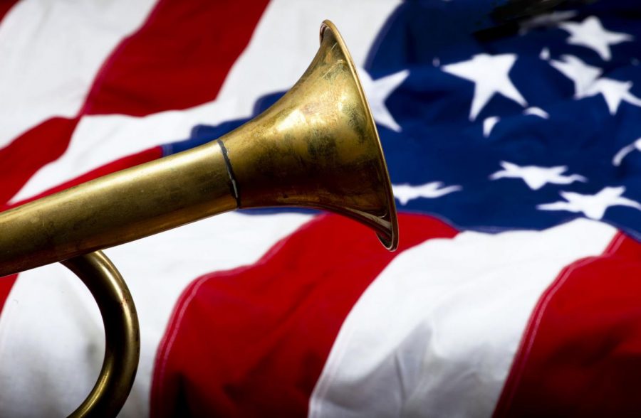 Brass bugle on American flag with room for your type.