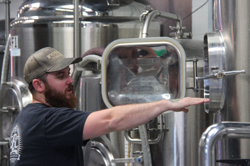 Head brewer John Sanderson shows some of the various instruments used to create microbrew craft beers.