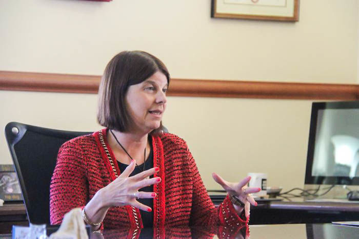 Acting President Lisa Freeman discusses her possible presidency in her office.