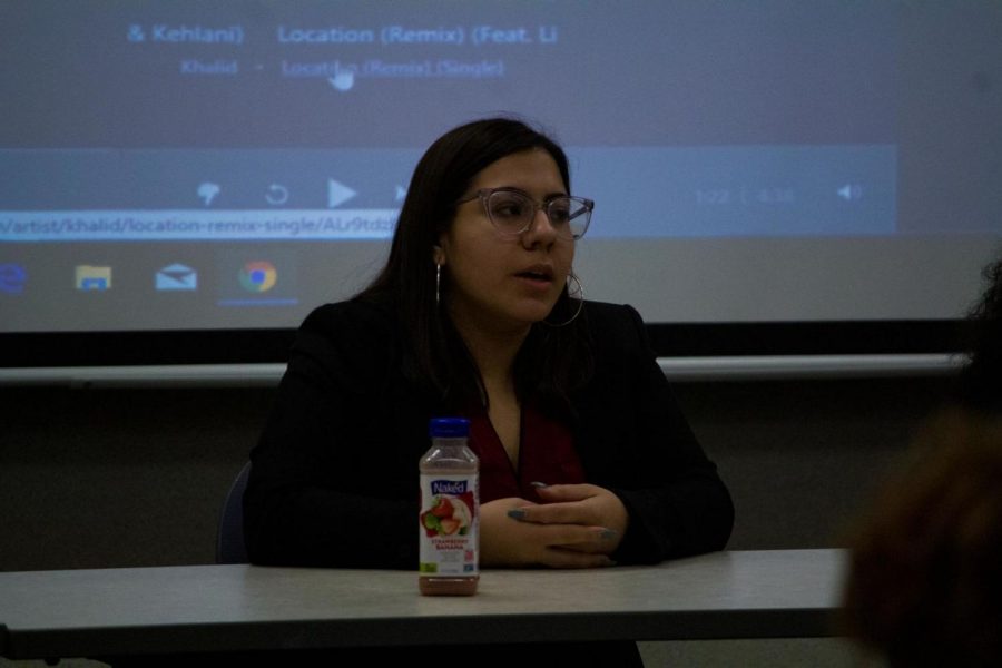 Sandra Puebla, senior political science major, introduces herself to the audience as a panelist for Tuesday evening’s discussion with Project Orange.