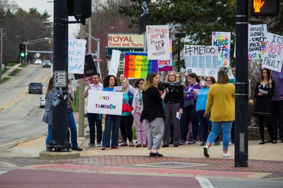 Residents and students gather and march Tuesday in downtown DeKalb to raise awareness for sexual assault survivors.