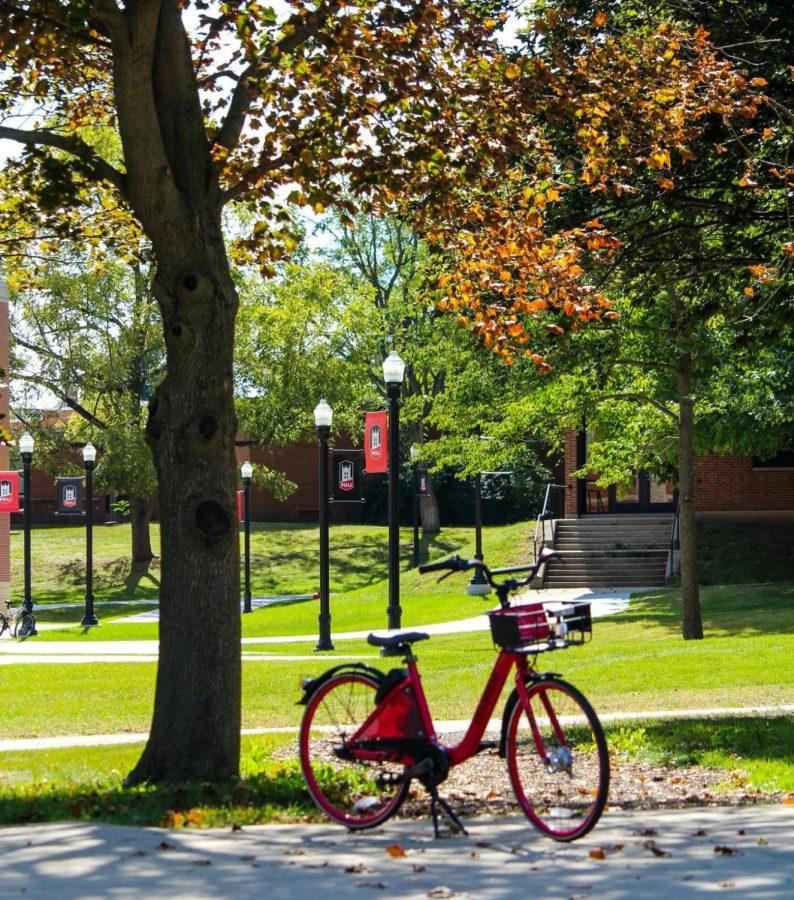 A VeoRide bike sits on a sidewalk behind Cole Hall Wednesday morning. 