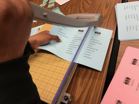 The students of Special Topics in Media Studies cut the voting ballots for this year's selected films for the Reality Bytes Film Festival, starting 9 p.m. April 9.