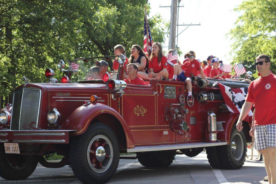 Children ride in an old fire engine at a previous DeKalb Memorial Day parade.