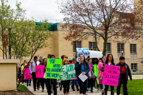 Sophomore nutrition major Fayth Springer leads a protest against the Title IX process Friday May 3.