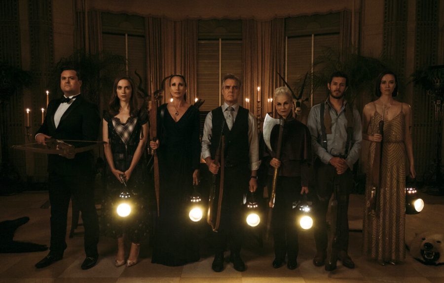 The Le Domas family, played by (from left) Kristian Bruun, Melanie Scrofano, Andie MacDowell, Henry Czerny, Nicky Guadagni, Adam Brody and Elyse Levesque, prepare to hunt down Grace, played by Samara Weaving, in Ready or Not.