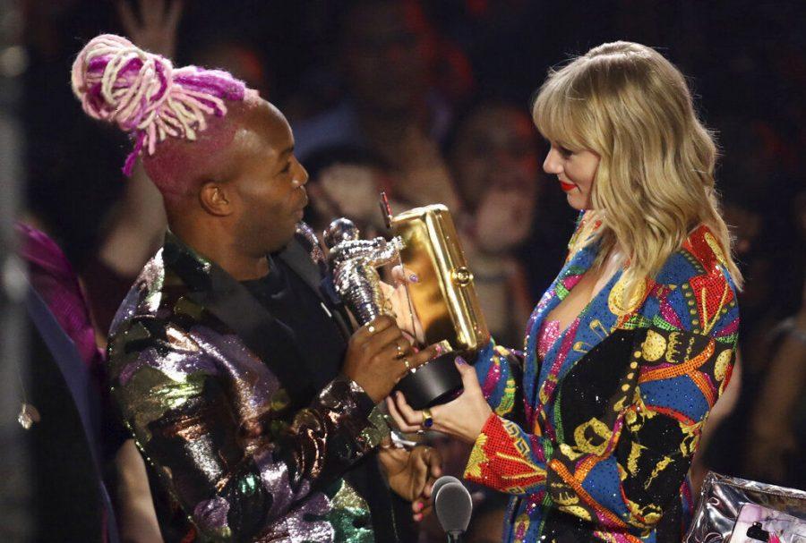 Todrick Hall, left, hands Taylor Swift the Video of the Year award for You Need to Calm Down Aug. 26 at the MTV Video Music Awards.