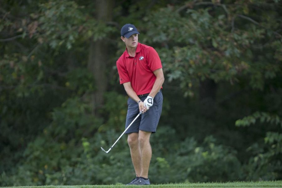 Senior golfer Michael Mattas aims at his target. 