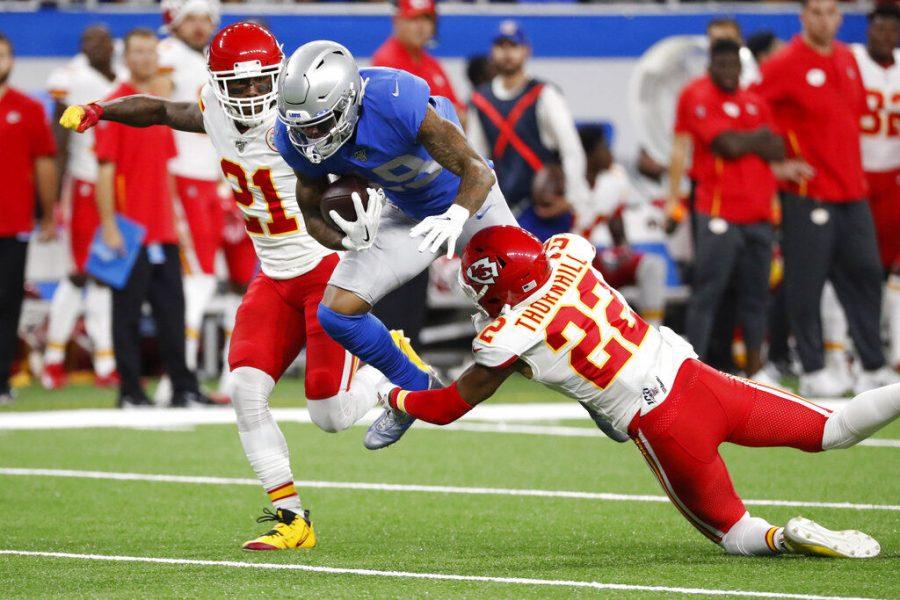 Detroit Lions wide receiver Kenny Golladay (19) is tackled by Kansas City Chiefs free safety Juan Thornhill (22) during the first half of an NFL football game, Sunday, Sept. 29, 2019, in Detroit. (AP Photo/Rick Osentoski)