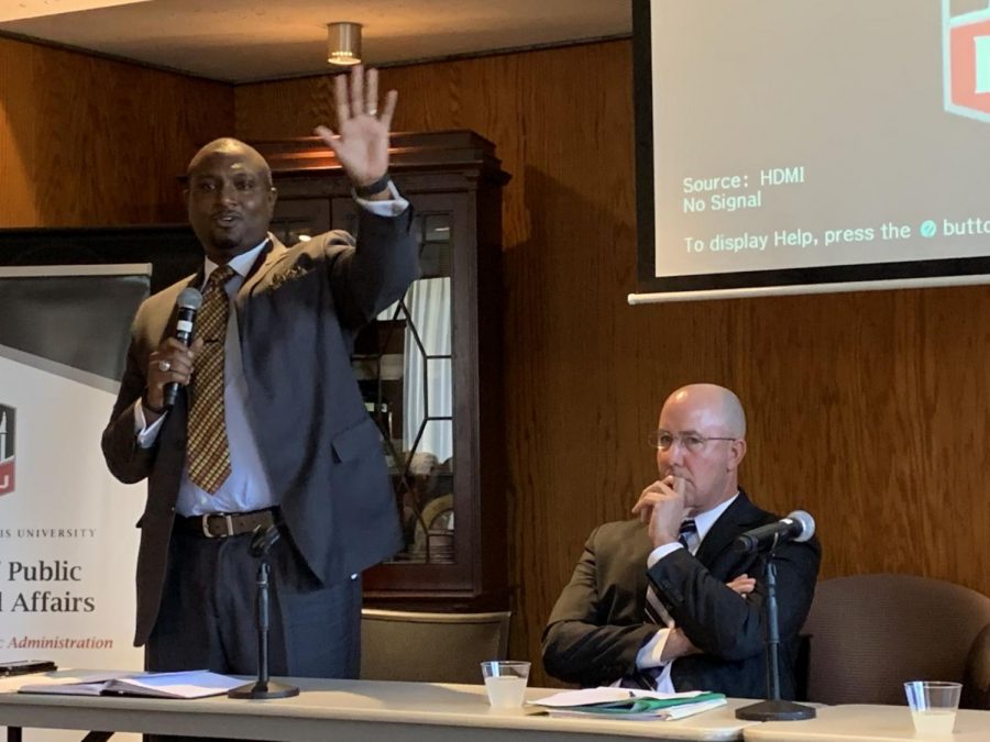 State Rep. Maurice A. West II (left), a Democrat from Illinois’ 67th District, stands up to deliver his opening statement beside his colleague Rep. Lance Yednock, D-76, on Monday at the Illinois bipartisan budget debate.