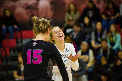 Senior setter Amanda Krahl (left), has a word with junior libero Miranda Karlen Friday during an eventual 3-1 victory against Kent State University at Victor E. Court.