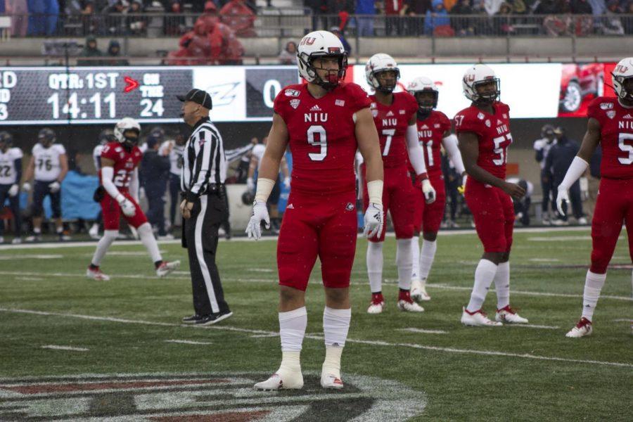 Junior defensive end Matt Lorbeck awaits pre snap Saturday as the defense looks to its coaches for the next call during NIUs 49-0 win against Akron at Huskie Stadium.