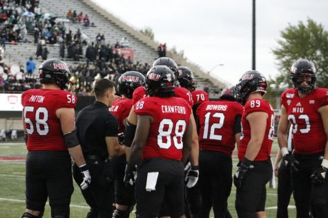 The Huskies gather in a huddle during the October 5th loss to Ball State, 27-20.
