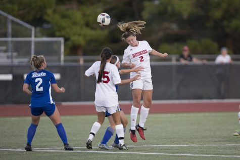 Senior Lauren Neslund clears the ball from danger Aug. 9, 2017 during NIU's exhibition match against Drake University.