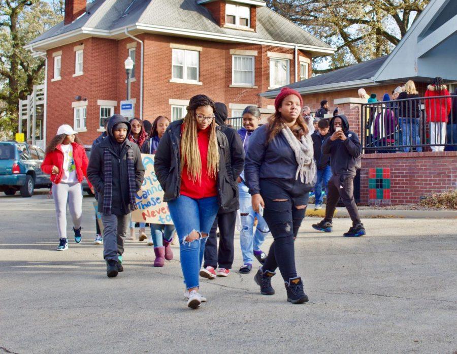 Protesters march Saturday outside the Center of Black Studies. NIU's NAACP chapter organized a march against perceived unequal treatment by the City of DeKalb police department.