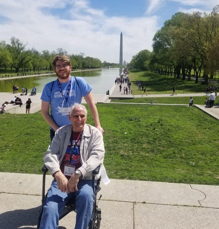 Northern Star contributor Jack Baudoin (back) stands in front of the Washington Monument with his grandfather, James Hill, April 20 in Washington D.C.