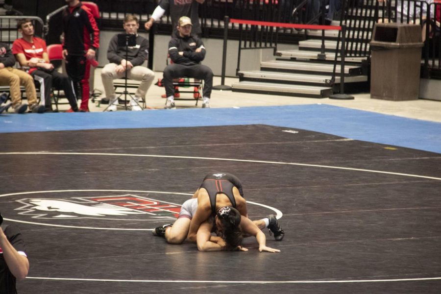 First-year+Izzak+Olejnik+%28top%29+attempts+to+pin+his+opponent+Friday+during+NIUs+38-4+win+against+the+University+of+Arkansas%E2%80%93Little+Rock+at+the+Convocation+Center.%C2%A0