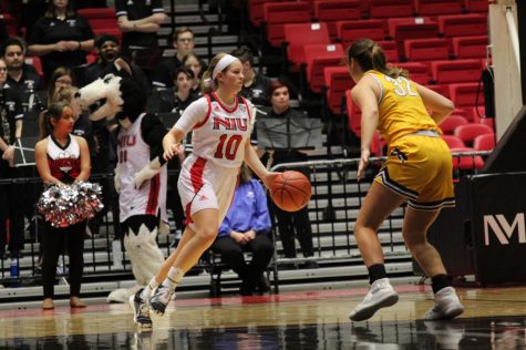 First-year guard Chelby Koker drives past a Golden Flash defender Wednesday during NIUs 79-71 loss to Kent State University at the Convocation Center.