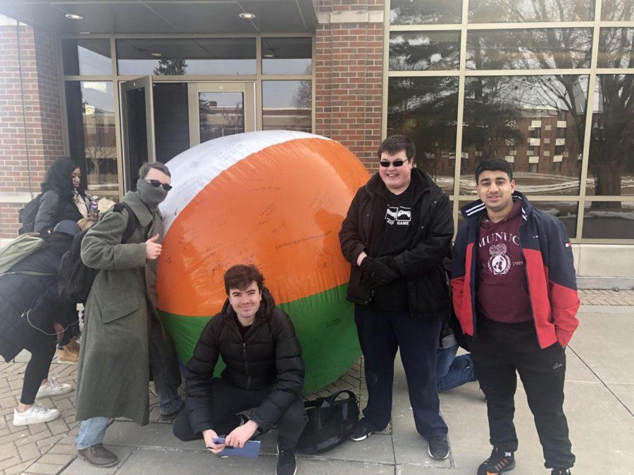 Young Americans for Liberty members (left to right) Evan Cinkovich, Reece Mendicino, Josh Harvey and Masood Ahmed stand in front of free speech ball outside Cole Hall, Friday.