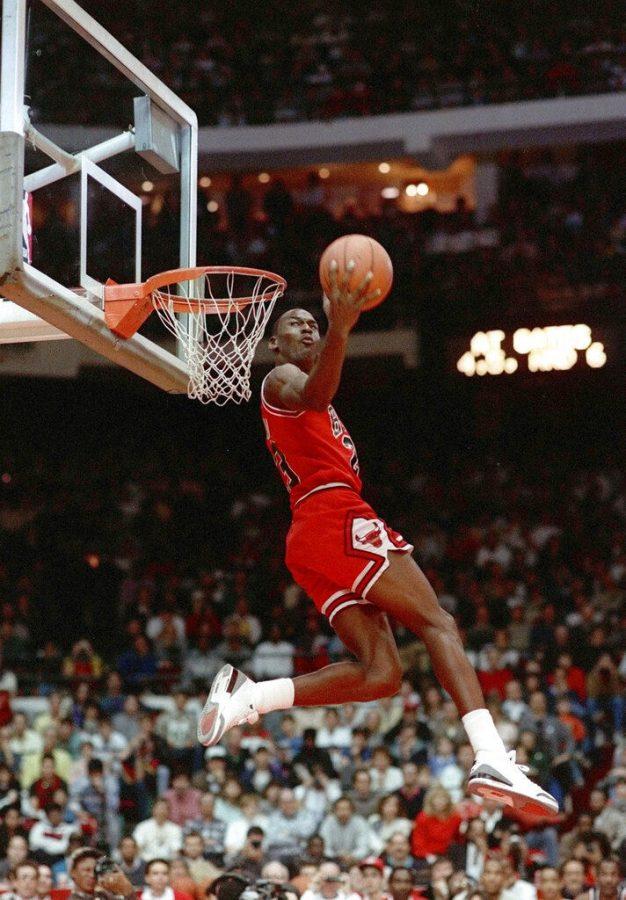 FILE - In this Feb. 6, 1988, file photo, Chicago Bulls Michael Jordan dunks during the slam-dunk competition of the NBA All-Star weekend in Chicago. Jordan left the old Chicago Stadium that night with the trophy. To this day, many believe Wilkins was the rightful winner. (AP Photo/John Swart)