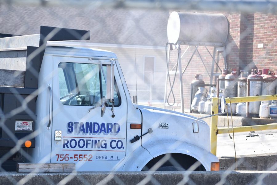 Smoke burns from debris Sunday at the Standard Roofing Company, 1000 S. Seventh Street.